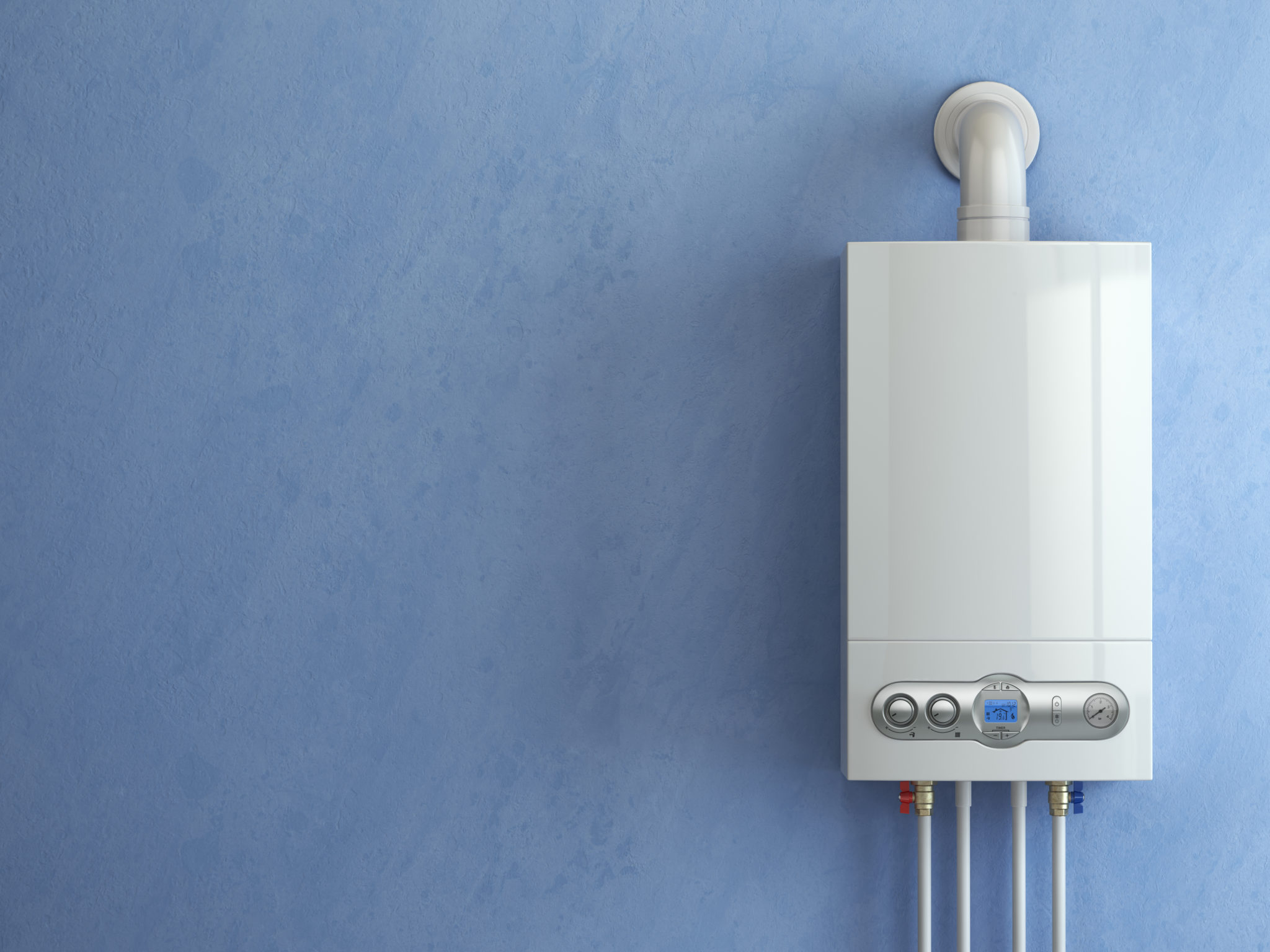 Aquecedor branco instalado em parede azul, com tubulação superior e conexões inferiores aparentes.